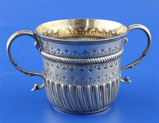 A George V early 18th century style repousse silver porringer, 8 oz.